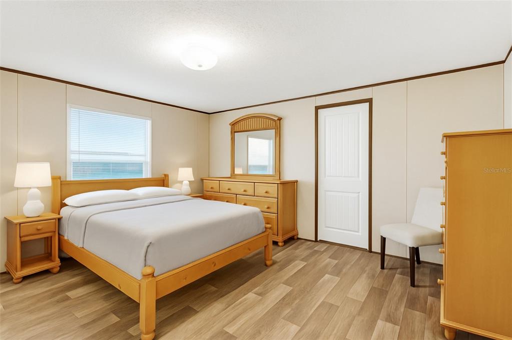 327 Tindel Camp Road Lake Wales, FL 33898 - Photo 4 of 10 a bedroom with a bed and a table in it