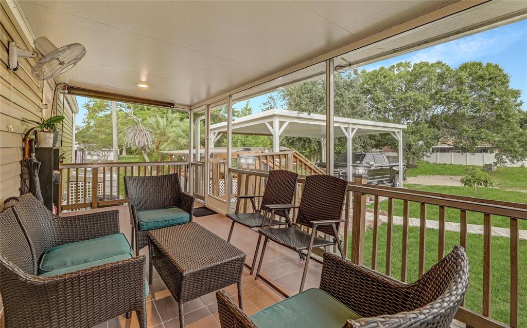 327 Tindel Camp Road Lake Wales, FL 33898 - Photo 5 of 10 a view of a chair and table in the balcony