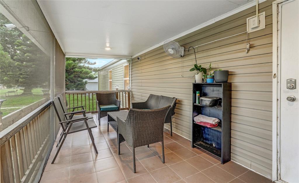 327 Tindel Camp Road Lake Wales, FL 33898 - Photo 6 of 10 a balcony with furniture and a potted plant