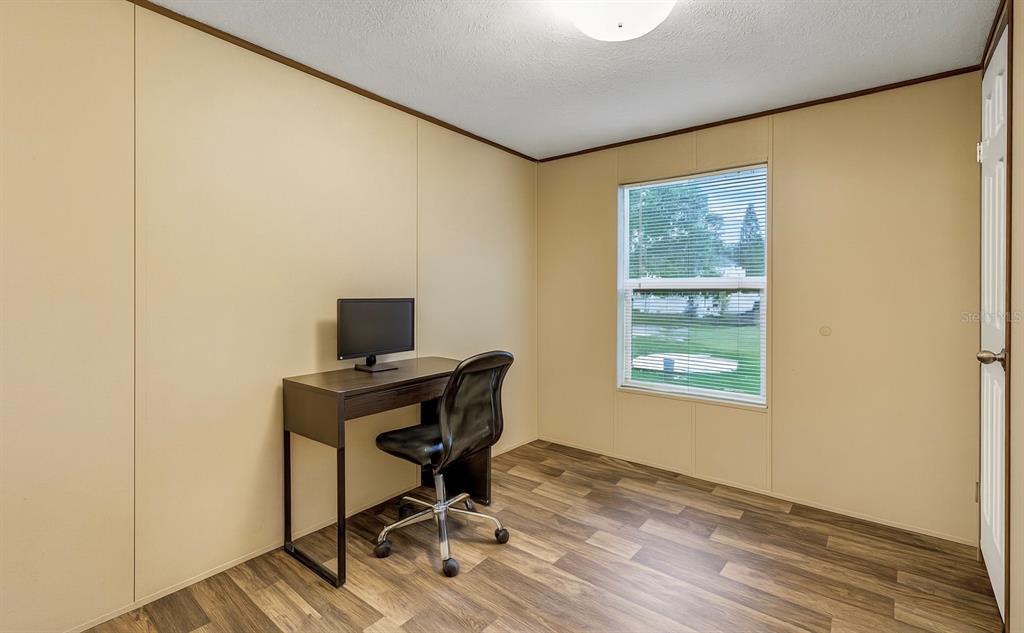 327 Tindel Camp Road Lake Wales, FL 33898 - Photo 8 of 10 a workspace with furniture and a window