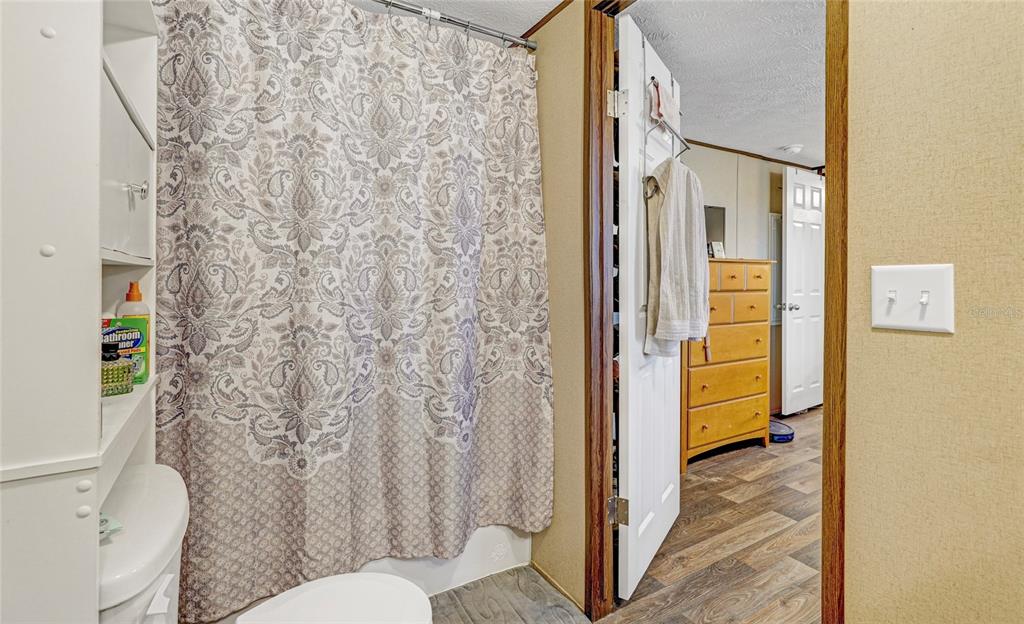 327 Tindel Camp Road Lake Wales, FL 33898 - Photo 10 of 10 a bathroom with a granite countertop shower and a toilet