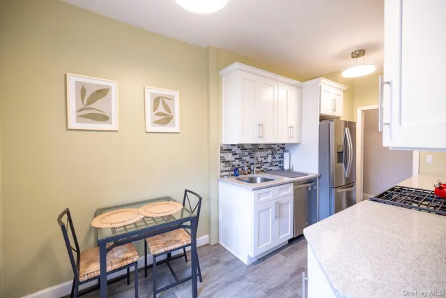 a living room with furniture wooden floor and a flat screen tv