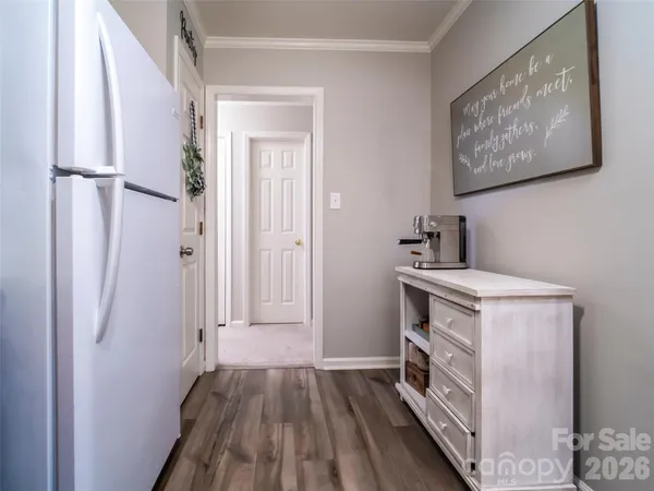 a storage room with wooden floor and window