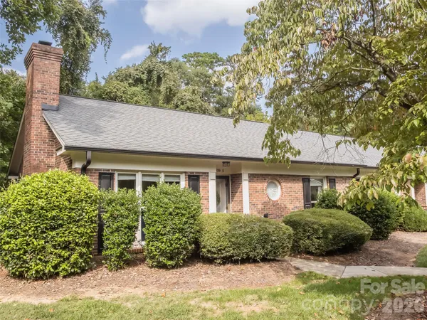 front view of a house with a garden