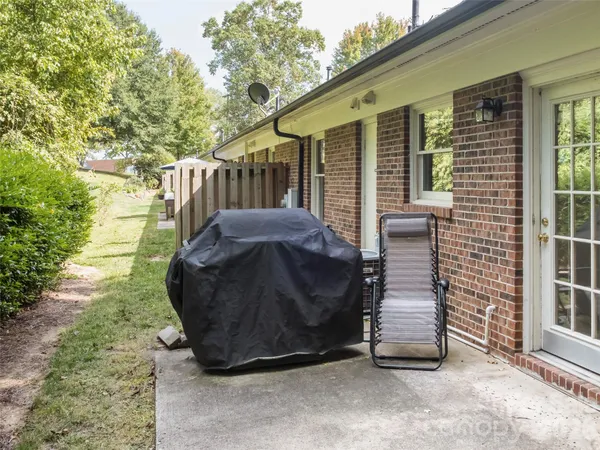 a front view of a house with a yard and flowers
