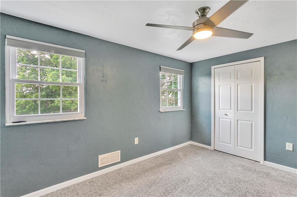 55 Dover Road Irwin, PA 15642 - Photo 18 of 25 3rd bedroom with ceiling fan and newer carpeting.