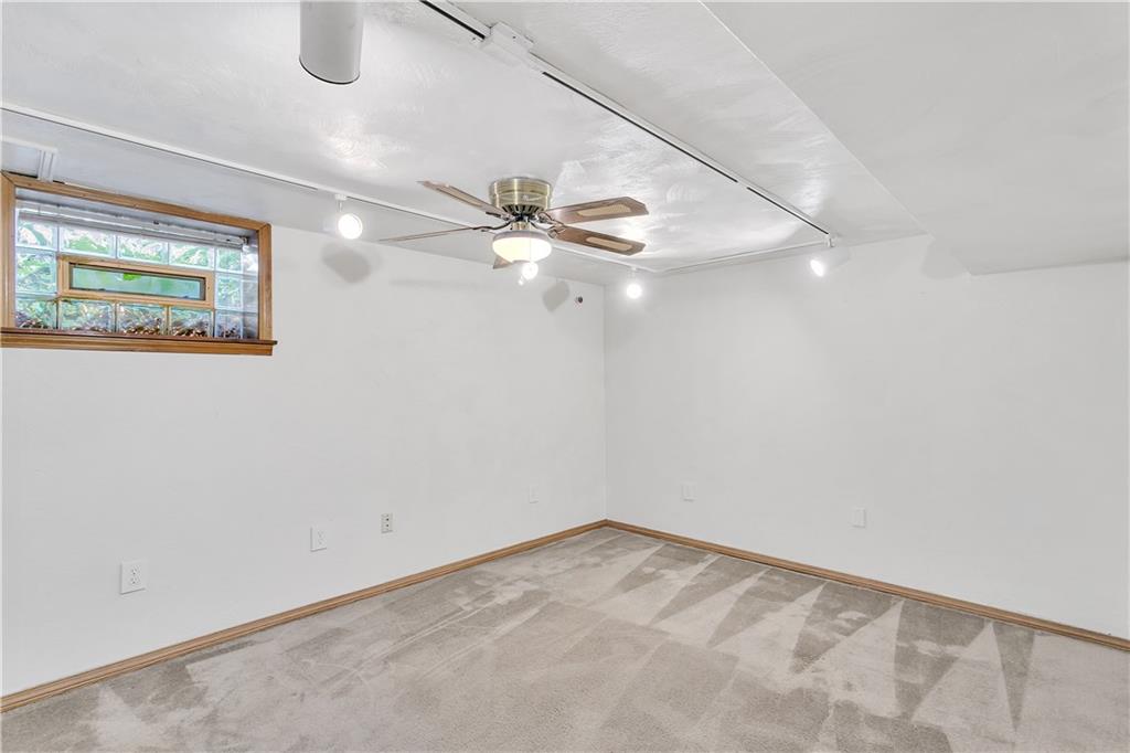 55 Dover Road Irwin, PA 15642 - Photo 20 of 25 Game room with ceiling fan and track lighting.