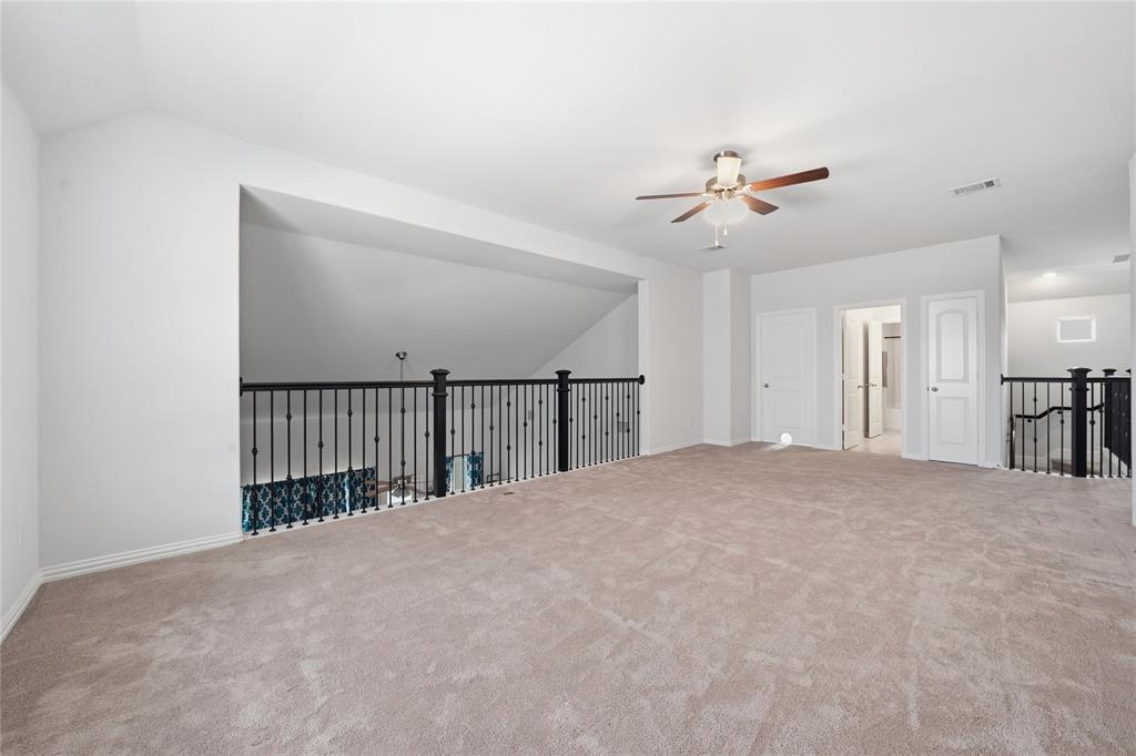 4542 Kipling Avenue Aubrey, TX 76227 - Photo 20 of 34 a view of a livingroom with a ceiling fan and hardwood floor