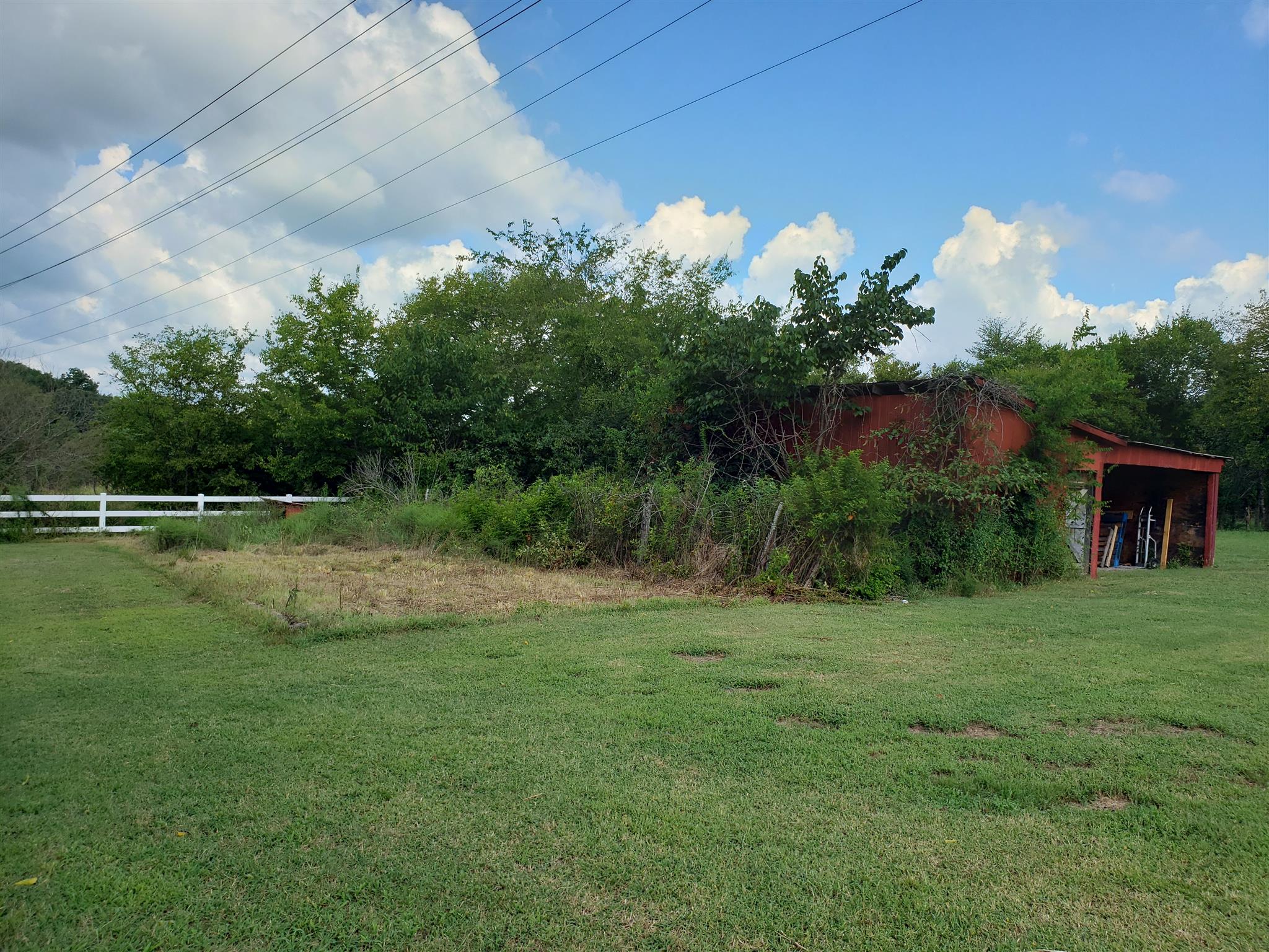 3122 Hunters Point Pike Lebanon, TN 37087 - Photo 11 of 28 Garden spot and barn that has a shared interest with neighbor. left side is owned by seller right side is owned by neighbor. The neighboring property was once owned by family and barn straddles property line