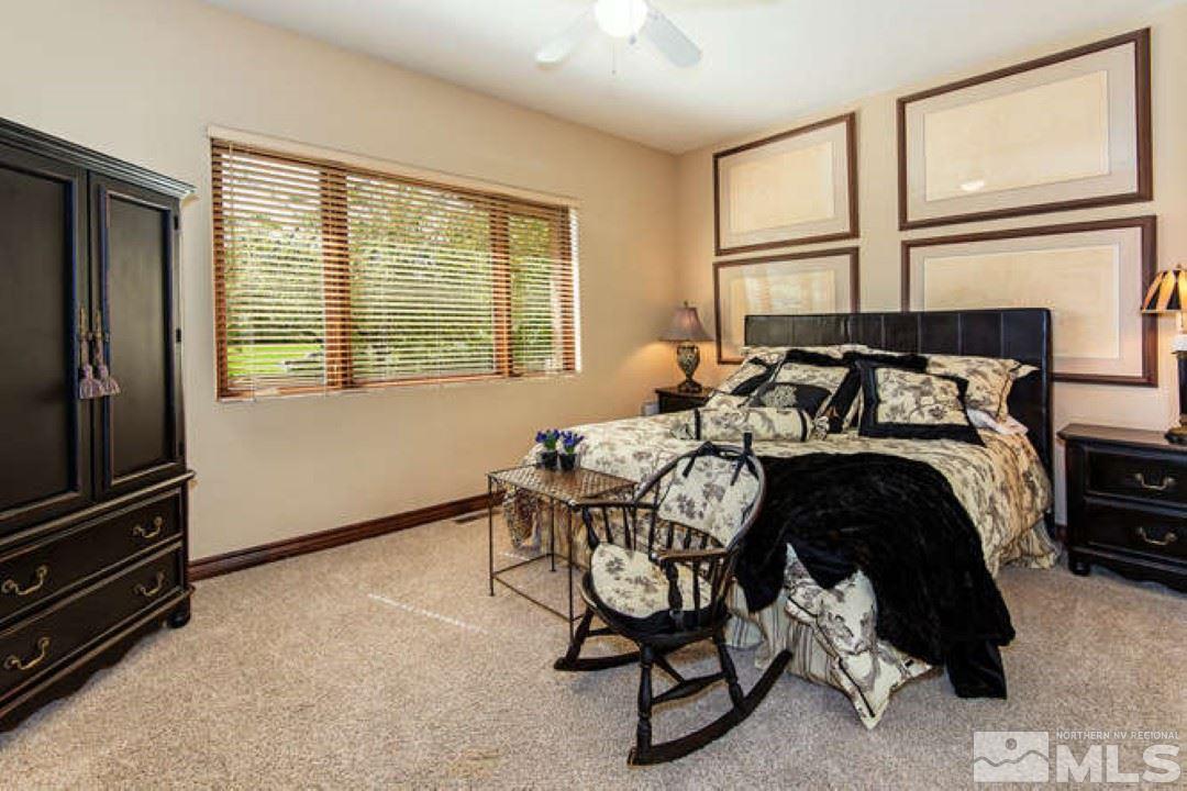 12760 Silver Wolf Road Reno, NV 89511 - Photo 14 of 25 a bedroom with a bed and a window