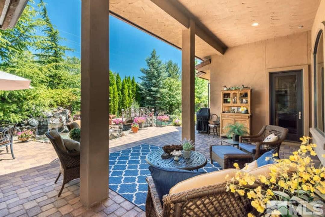 12760 Silver Wolf Road Reno, NV 89511 - Photo 15 of 25 a front view of a house with outdoor seating