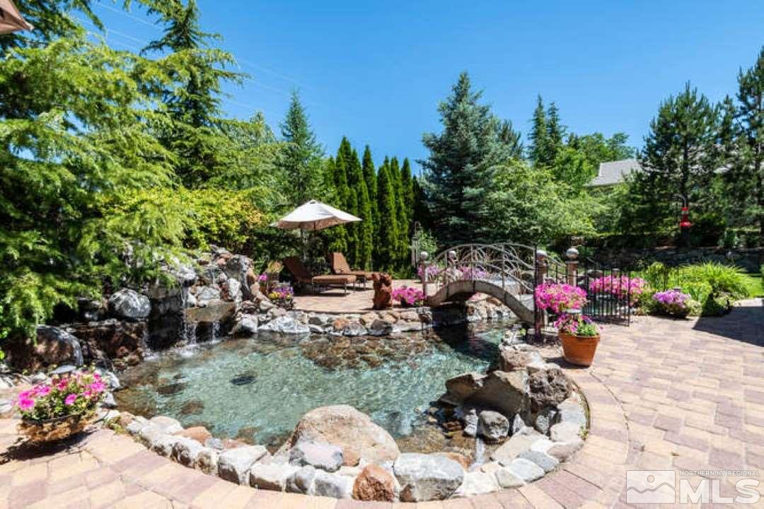 12760 Silver Wolf Road Reno, NV 89511 - Photo 16 of 25 a view of a backyard with plants and a patio
