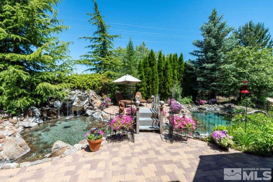 12760 Silver Wolf Road Reno, NV 89511 - Photo 17 of 25 a view of a filled with lots of flowers and trees