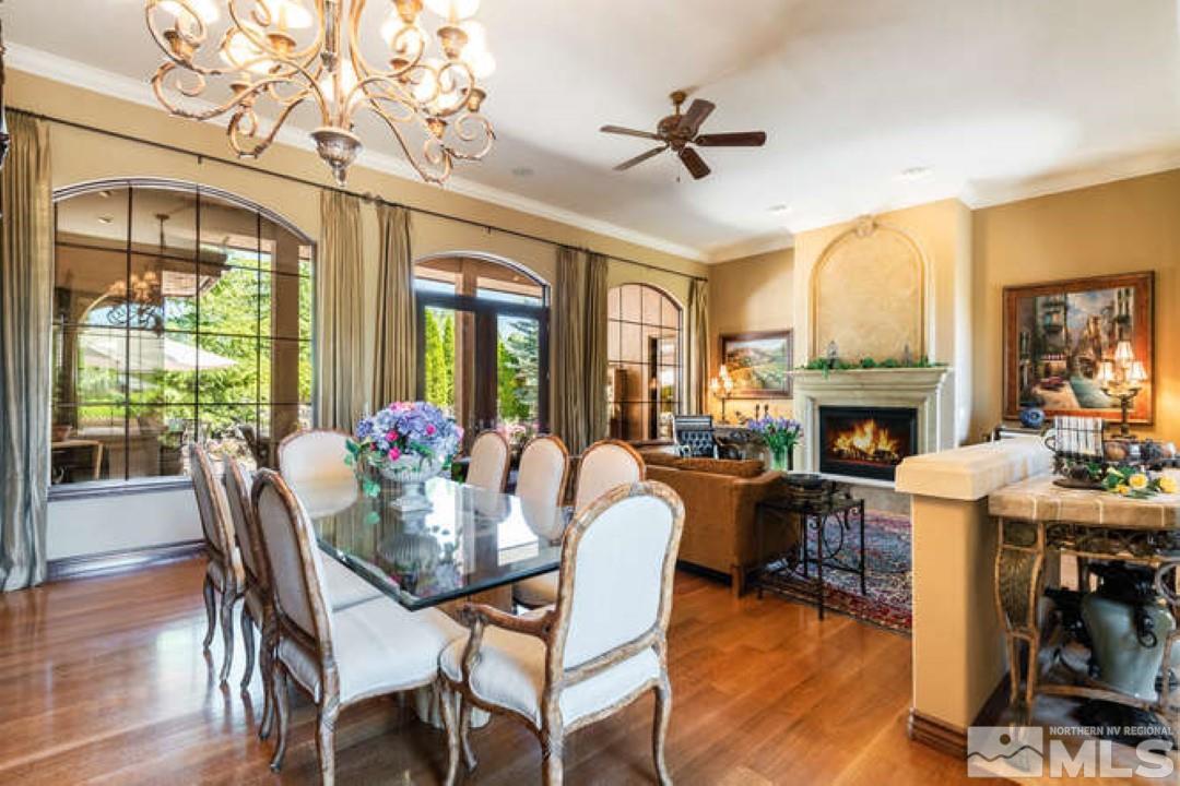 12760 Silver Wolf Road Reno, NV 89511 - Photo 4 of 25 a view of a dining room with furniture window and wooden floor