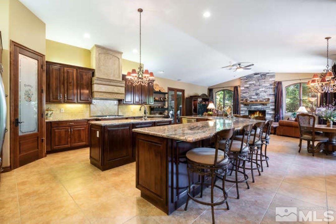 12760 Silver Wolf Road Reno, NV 89511 - Photo 6 of 25 a kitchen with a table and chairs in it