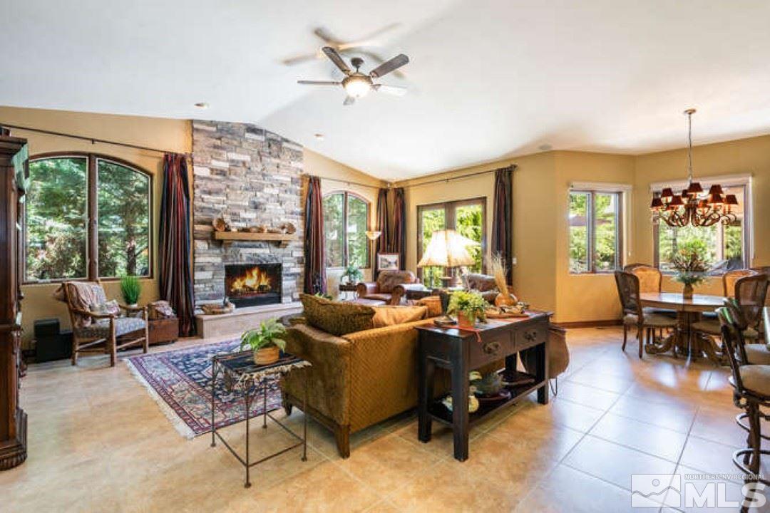 12760 Silver Wolf Road Reno, NV 89511 - Photo 8 of 25 a living room with furniture large window and a table