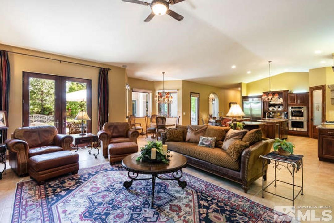 12760 Silver Wolf Road Reno, NV 89511 - Photo 9 of 25 a living room with furniture and a large window