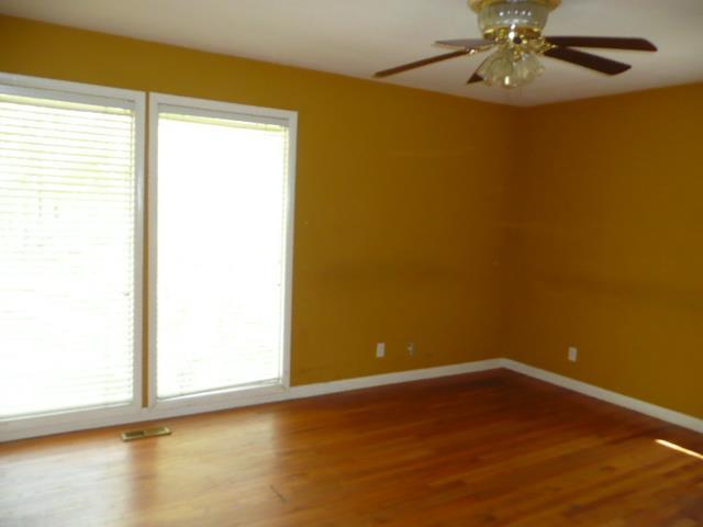 1918 Wood Valley Road Macon, GA 31211 - Photo 22 of 26 a view of an empty room with wooden floor and a window