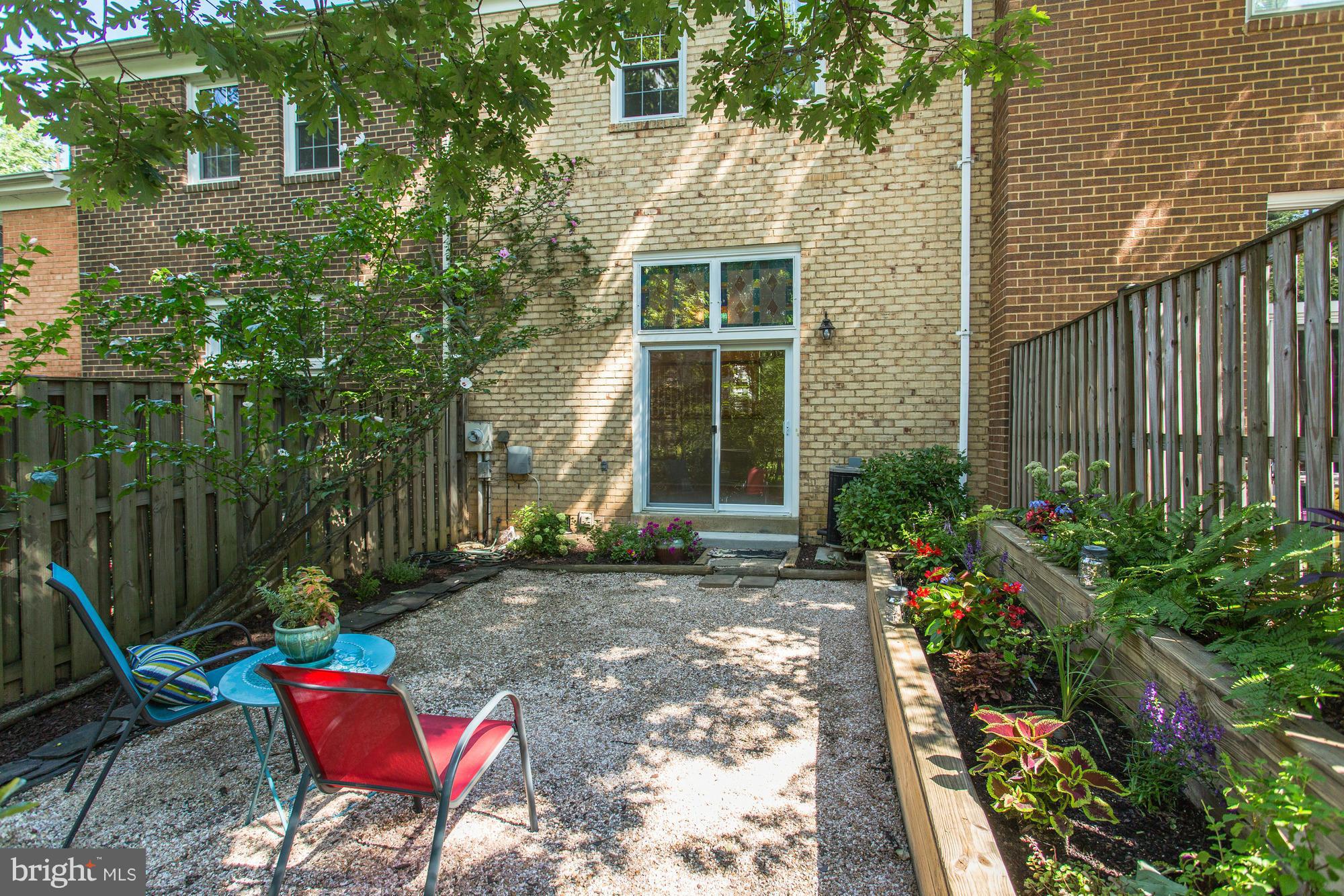 2409 Albot Road Reston, VA 20191 - Photo 4 of 24 a view of a house with backyard sitting area and garden