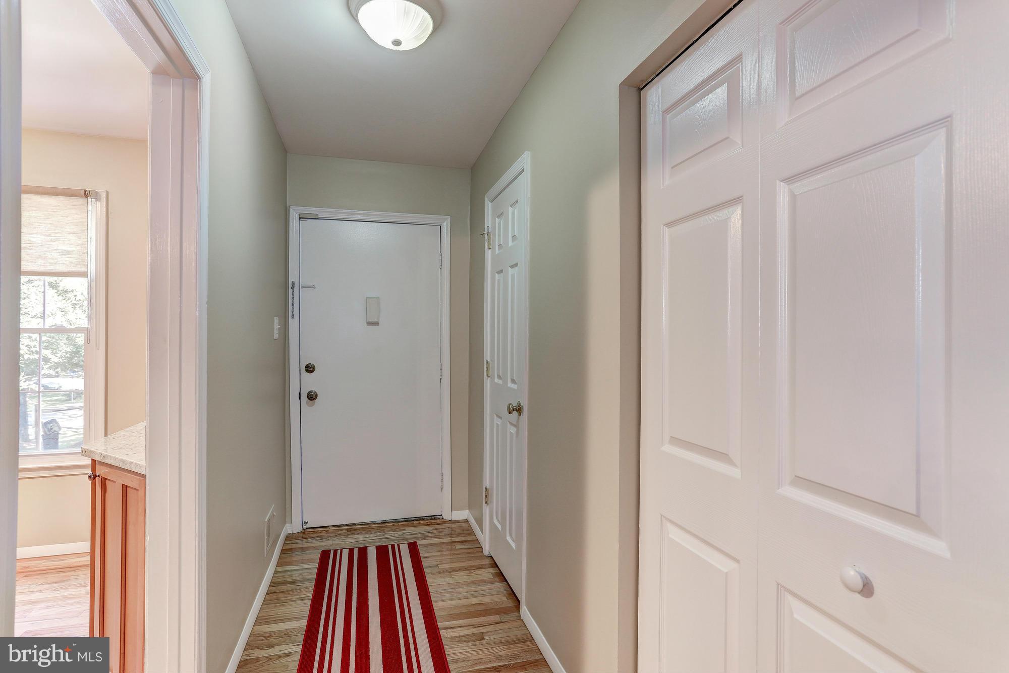 2409 Albot Road Reston, VA 20191 - Photo 5 of 24 a view of a room with wooden floor and windows