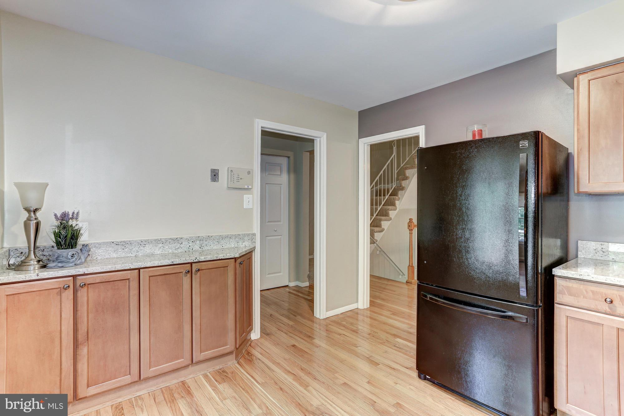 2409 Albot Road Reston, VA 20191 - Photo 7 of 24 a kitchen with stainless steel appliances a refrigerator and a sink
