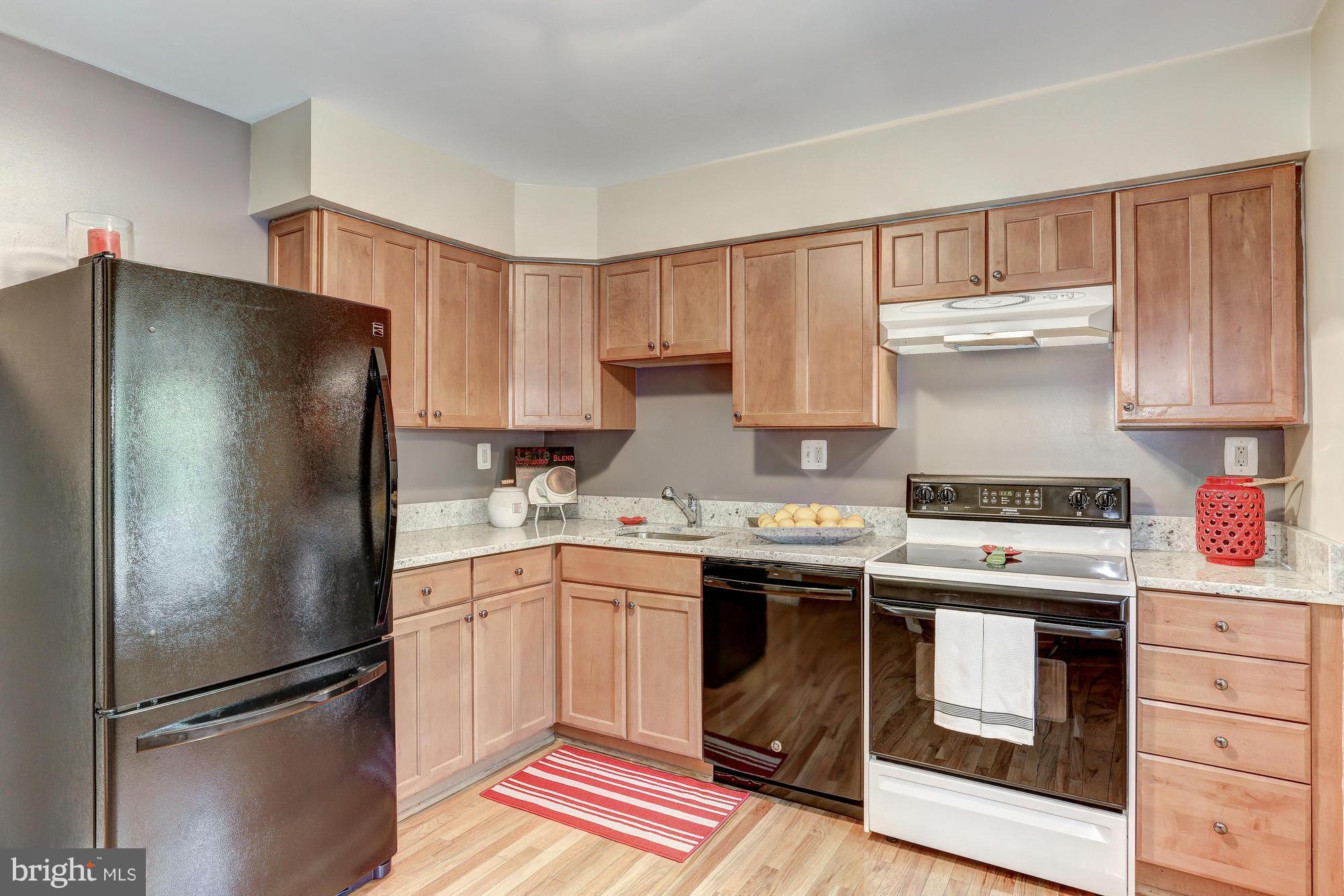 2409 Albot Road Reston, VA 20191 - Photo 8 of 24 a kitchen with a stove sink and refrigerator