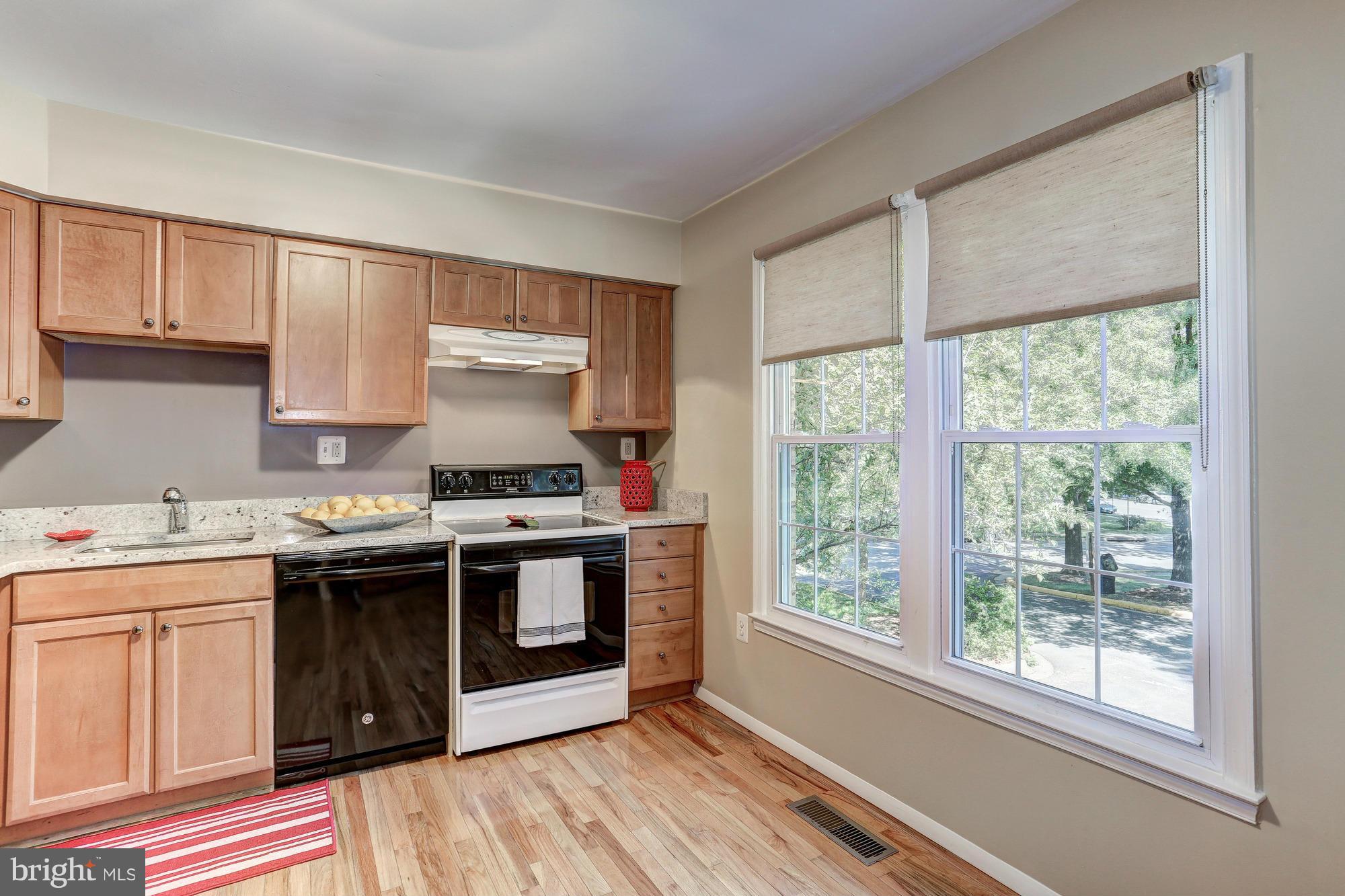 2409 Albot Road Reston, VA 20191 - Photo 9 of 24 a kitchen with a stove and a sink