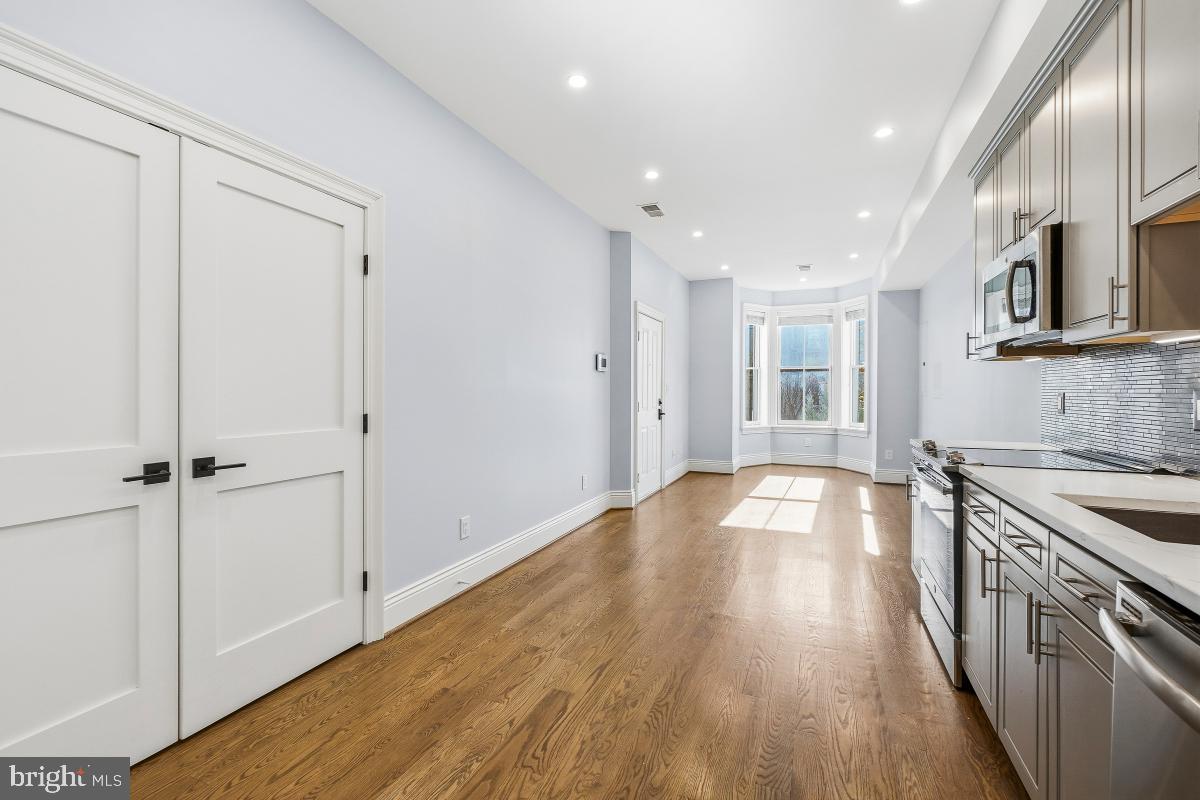 416 A Street Southeast, Unit 1 Washington, DC 20003 - Photo 15 of 30 a view of a kitchen with a sink and a stove top oven