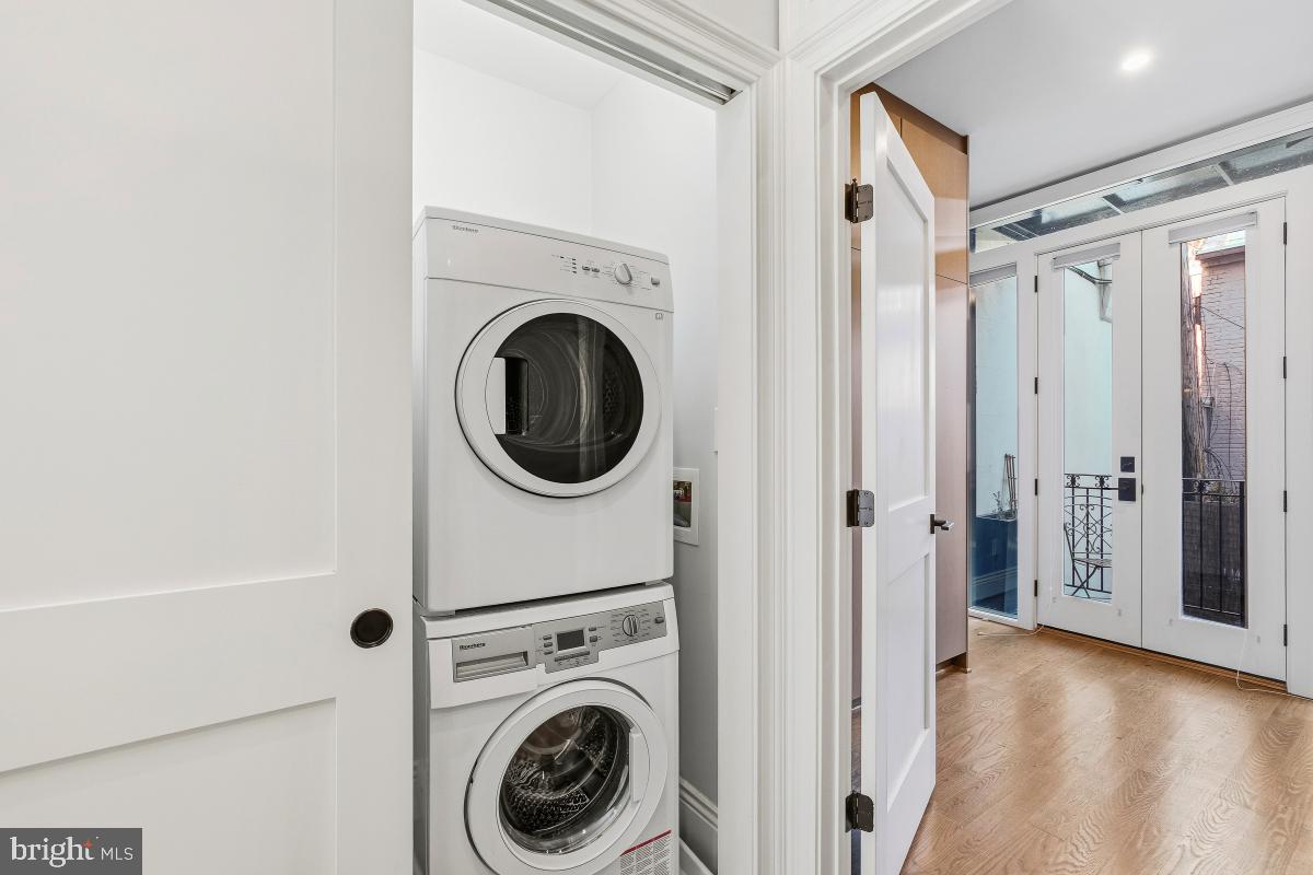416 A Street Southeast, Unit 1 Washington, DC 20003 - Photo 19 of 30 a view of a hallway with washer and dryer