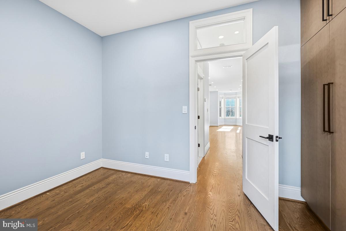 416 A Street Southeast, Unit 1 Washington, DC 20003 - Photo 25 of 30 a view of a hallway with wooden floor and closet area