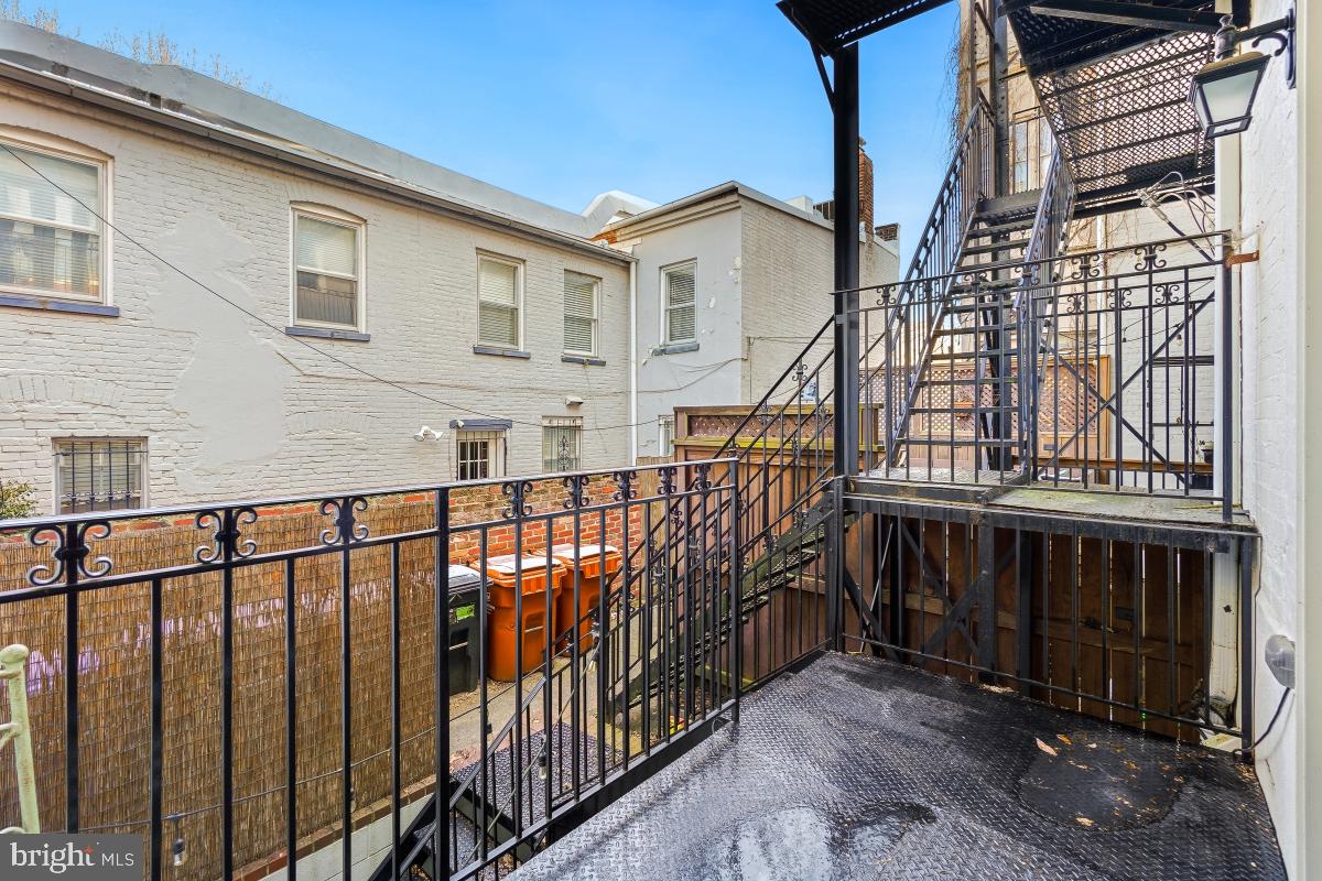 416 A Street Southeast, Unit 1 Washington, DC 20003 - Photo 26 of 30 a view of a house with wooden fence