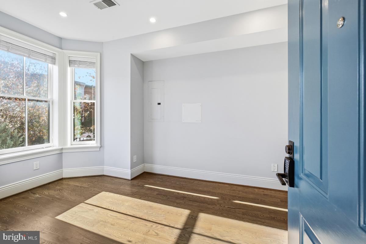 416 A Street Southeast, Unit 1 Washington, DC 20003 - Photo 4 of 30 a view of an empty room with a window