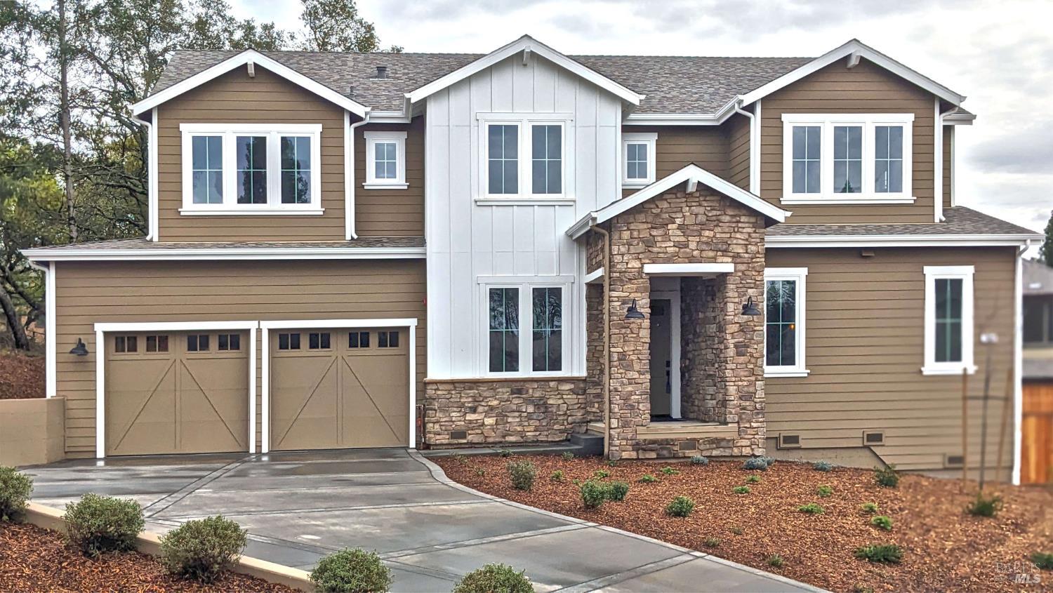 Newly completed traditional home nestled against a tree lined hillside that adjoins nearby Fir Ridge Park. Set back from road on .35 acres.