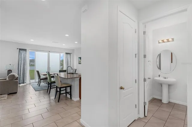 a bedroom with a bed and a refrigerator