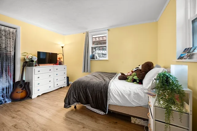 a bedroom with a bed and a tv