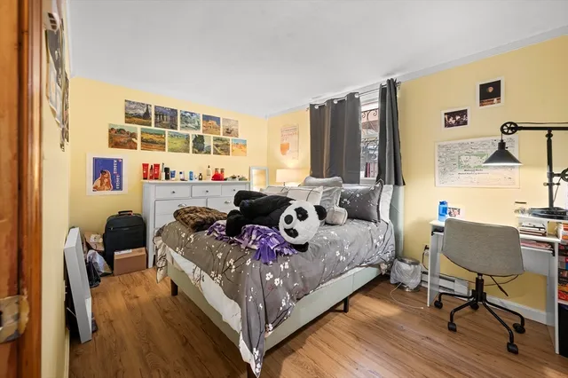 a bed room with a bed and a chair