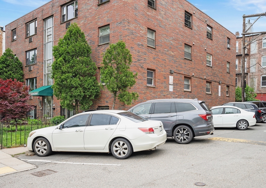 70 Jamaicaway, Unit 1 Boston, MA 02130 - Photo 17 of 19 a car parked in front of a car parked in front of a building