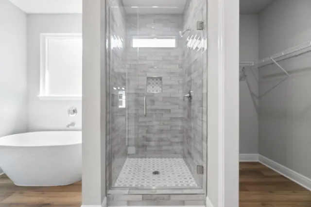 a bathroom with a shower and a sink