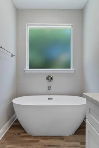 a white bath tub sitting in a bathroom