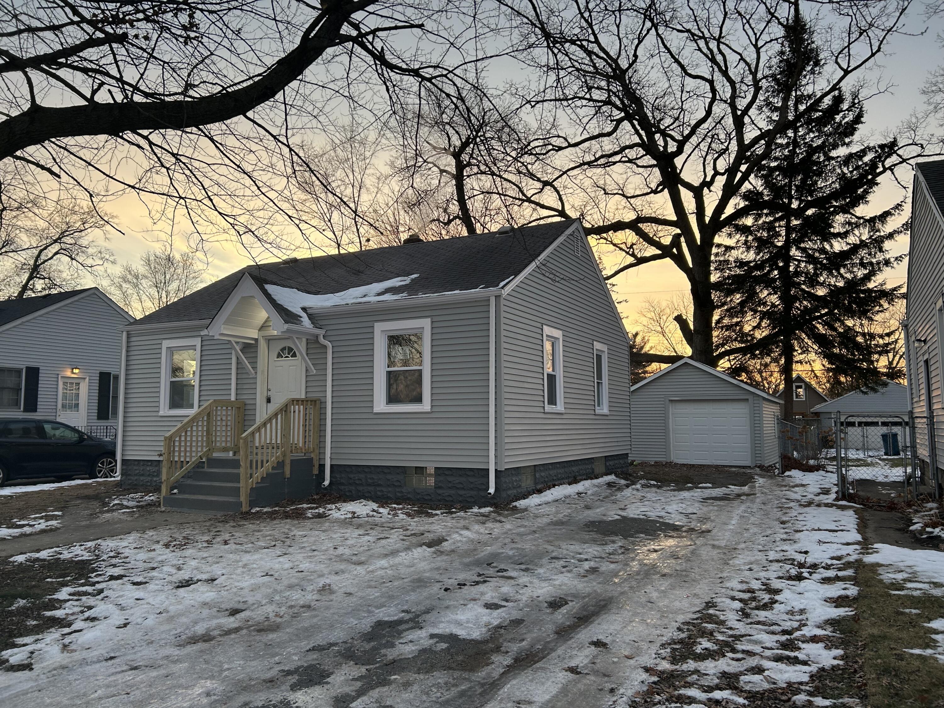 a house that has a tree in front of the house