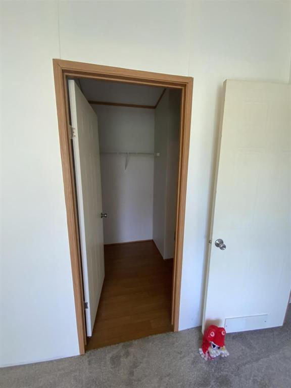 929 Neighbors Corner Road Mart, TX 76664 - Photo 16 of 28 an empty room with wooden floor and a window
