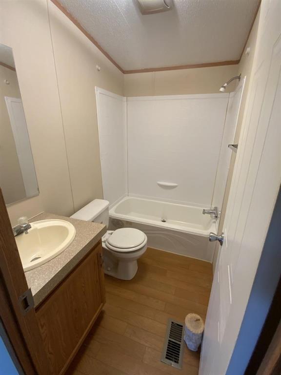 929 Neighbors Corner Road Mart, TX 76664 - Photo 21 of 28 a bathroom with a granite countertop sink a toilet and shower