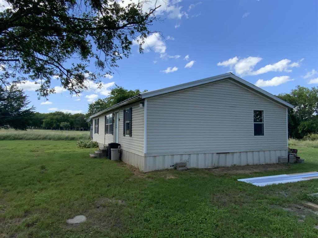 929 Neighbors Corner Road Mart, TX 76664 - Photo 24 of 28 a backyard of a house with lots of green space