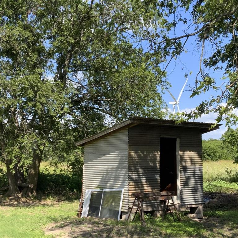 929 Neighbors Corner Road Mart, TX 76664 - Photo 25 of 28 a front view of a house with garden