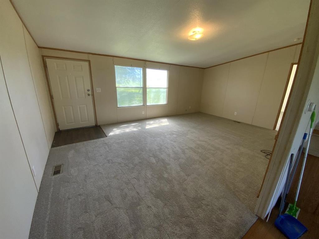 929 Neighbors Corner Road Mart, TX 76664 - Photo 4 of 28 an empty room with windows