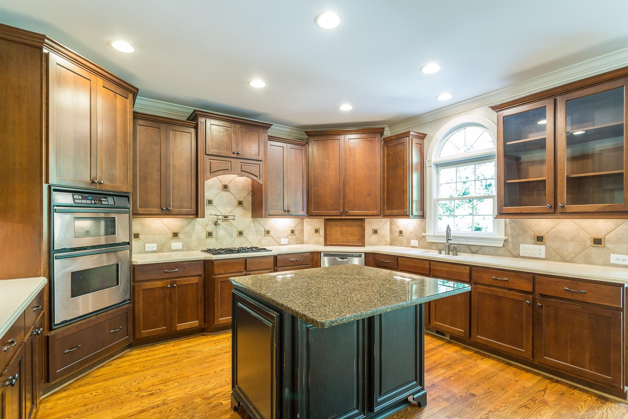 12008 Joseph Drive Raleigh, NC 27614 - Photo 8 of 30 Stainless appliances, tile backsplash, walk-in pantry, recessed lighting, hardwoods floors, and crown molding. Well-Designed Kitchen