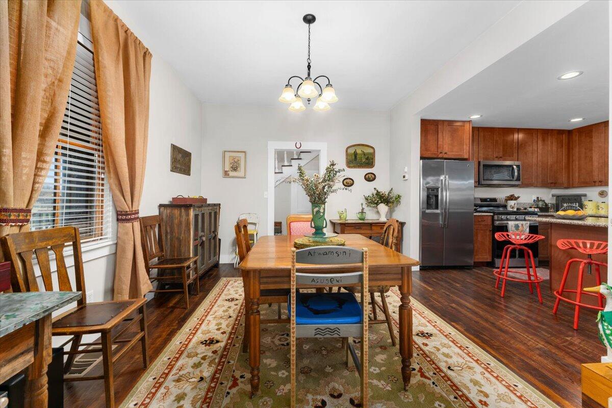 24894 Long Street Fall River Mills, CA 96028 - Photo 17 of 43 a dining room with furniture a chandelier and wooden floor