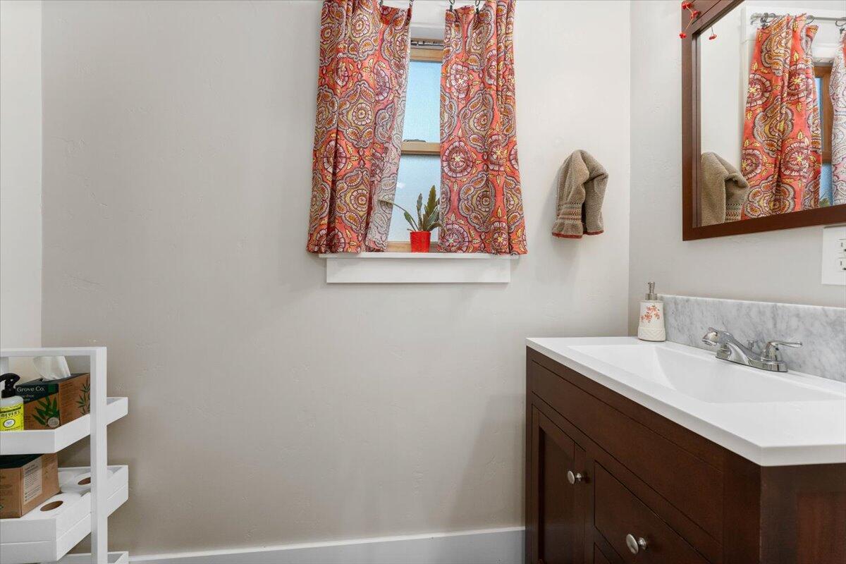 24894 Long Street Fall River Mills, CA 96028 - Photo 30 of 43 a bathroom with a sink and a mirror