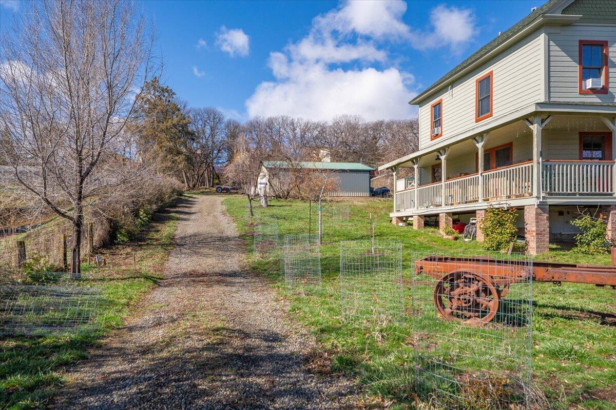 24894 Long Street Fall River Mills, CA 96028 - Photo 42 of 43 a view of a house with backyard and garden