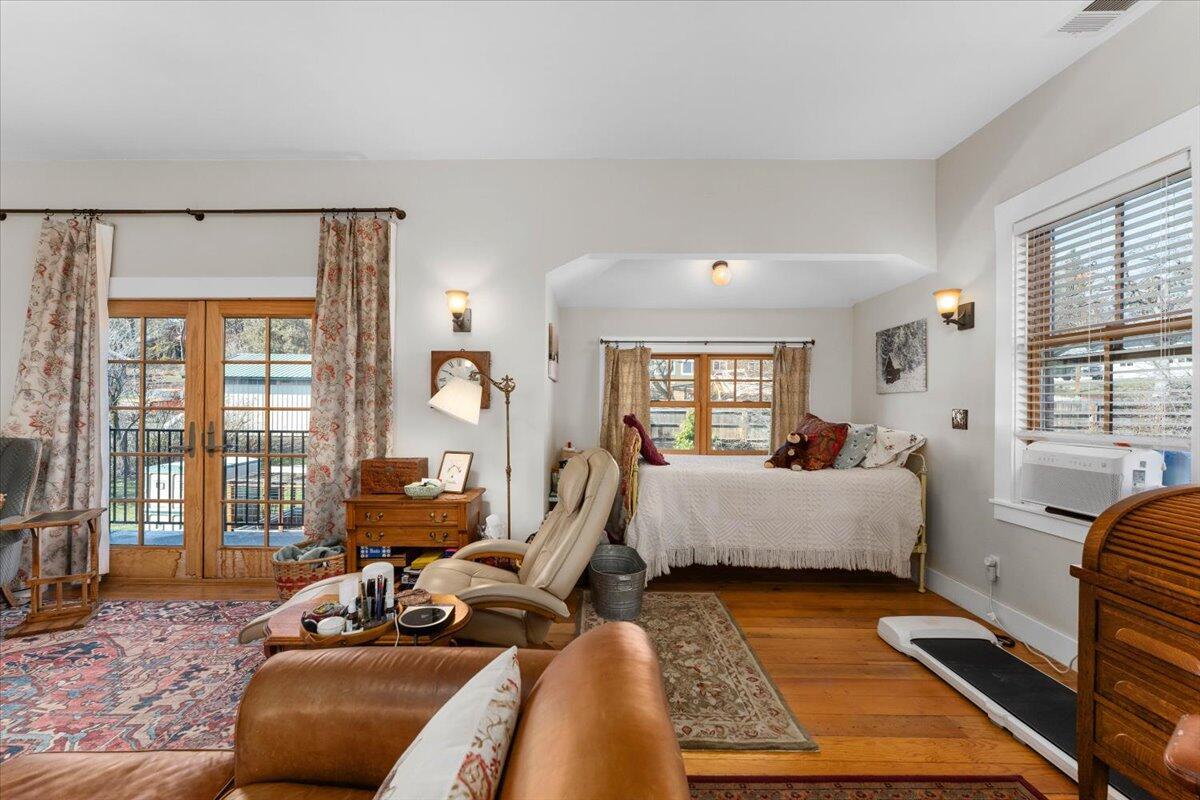 24894 Long Street Fall River Mills, CA 96028 - Photo 9 of 43 a living room with furniture wooden floor and a large window